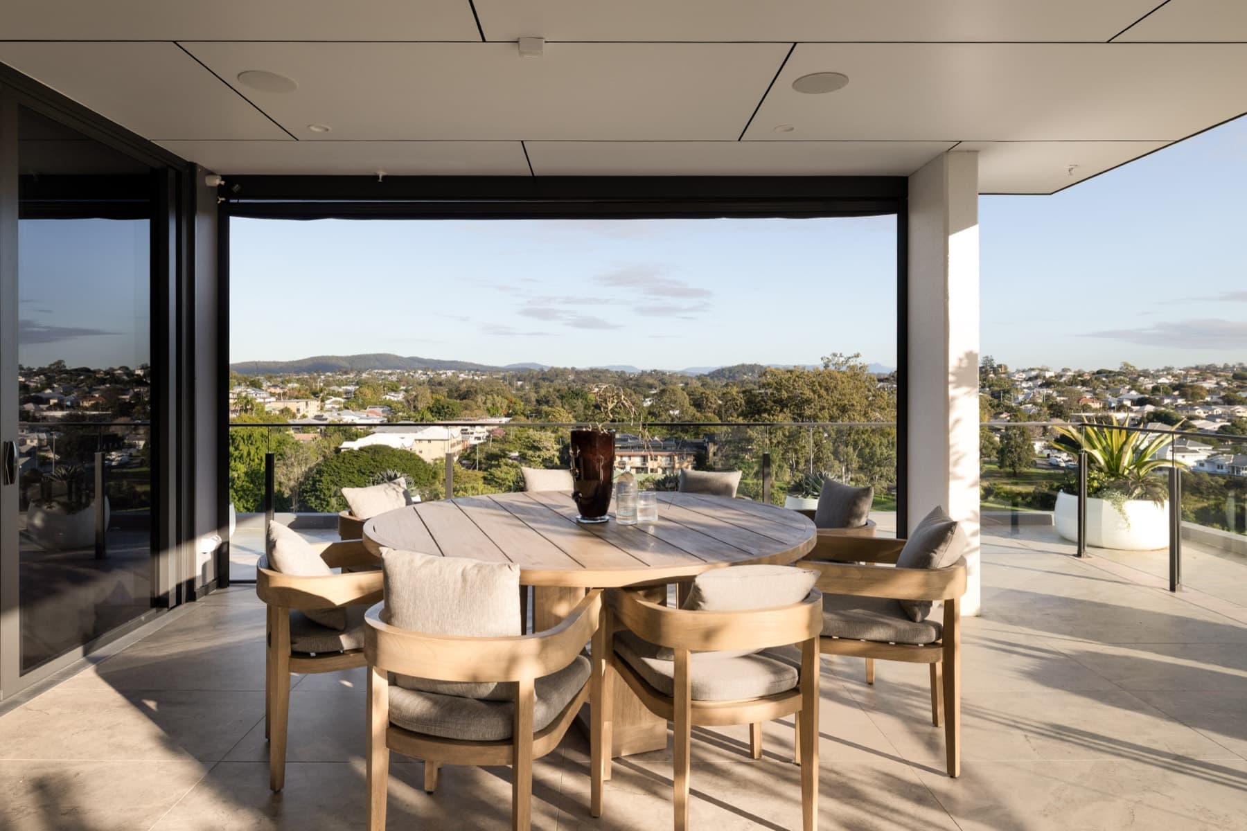 Alfresco terrace dining with sweeping views across Brisbane