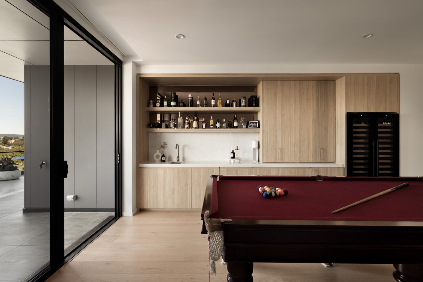 Lounge with billiards table and built-in bar