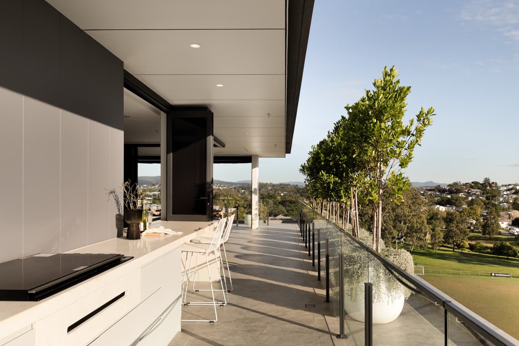 Terrace servery with outdoor kitchen and park outlook