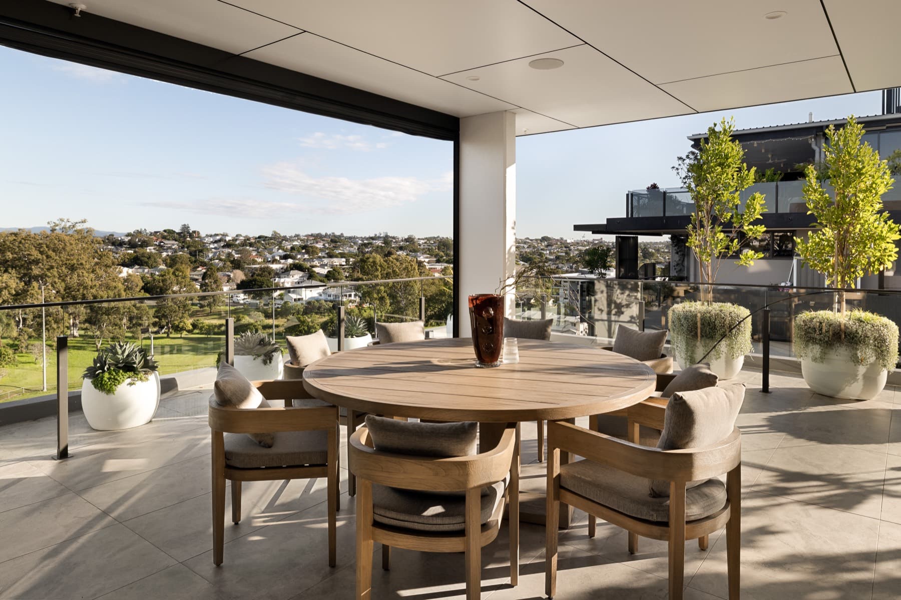 Covered terrace dining with panoramic views